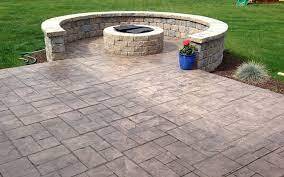 Stamped concrete patio tied in with fire pit
