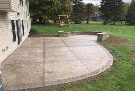 Stamped concrete patio with bonus space for fire pit
